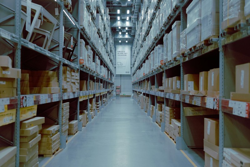 A warehouse aisle of stocked racking